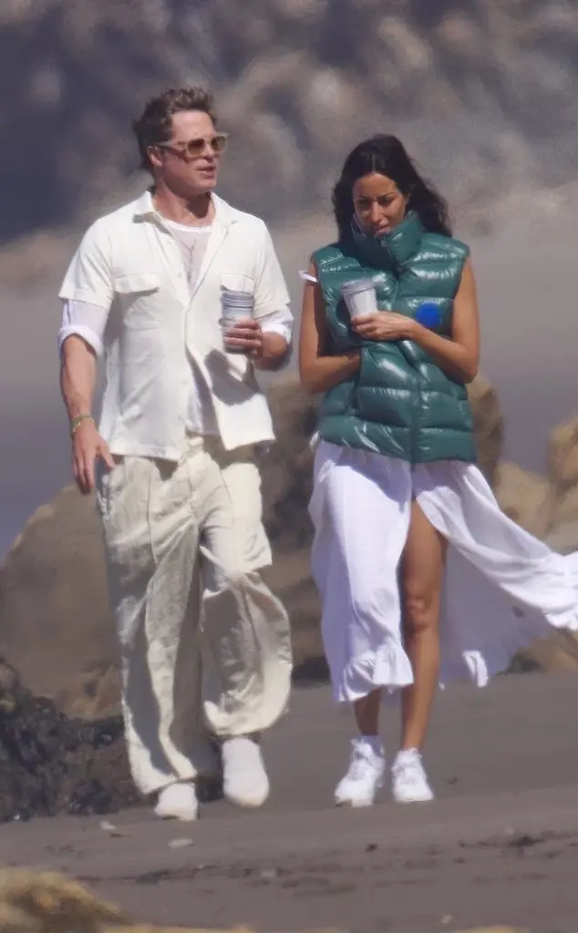 Brad Pitt and Ines De Ramon enjoy coffee on the beach