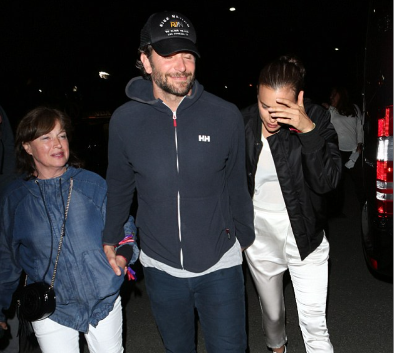 Bradley Cooper holding hands with Irina Shayk and her mother Olga (Image via AKM-GSI Media)