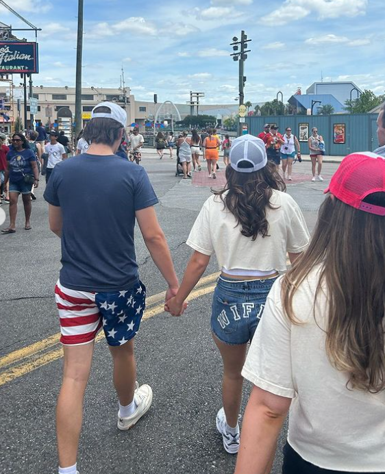 Millie Bobby Brown and Jake Bongiovi hold hands in Florida theme park