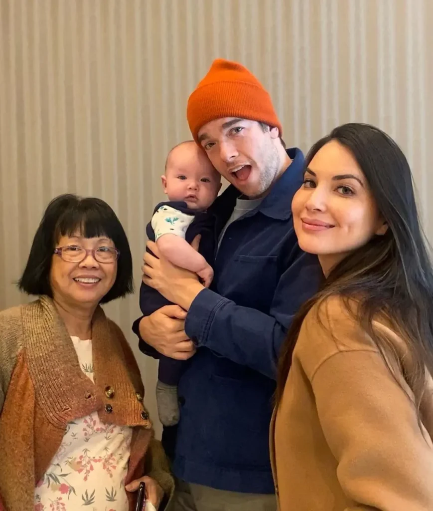 John Mulaney with Olivia Munn, their son, and his mother-in-law Kim Munn