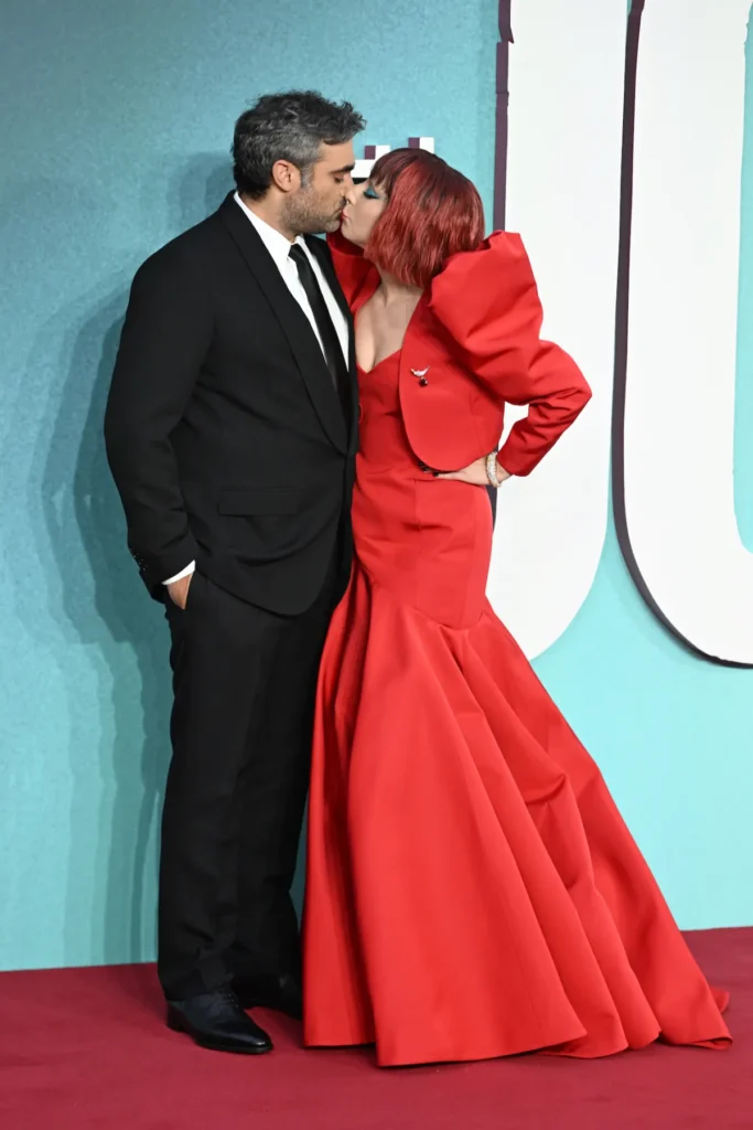 Lady Gaga and Michael Polansky share a sweet kiss on the red carpet