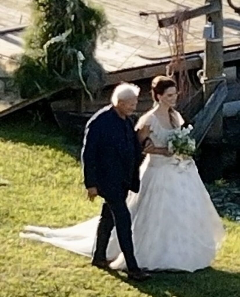 Lana Del Rey walking down the aisle with her father Robert Grant