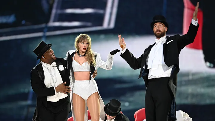 Taylor Swift and Travis Kelce onstage in London during one of her Eras Tour shows