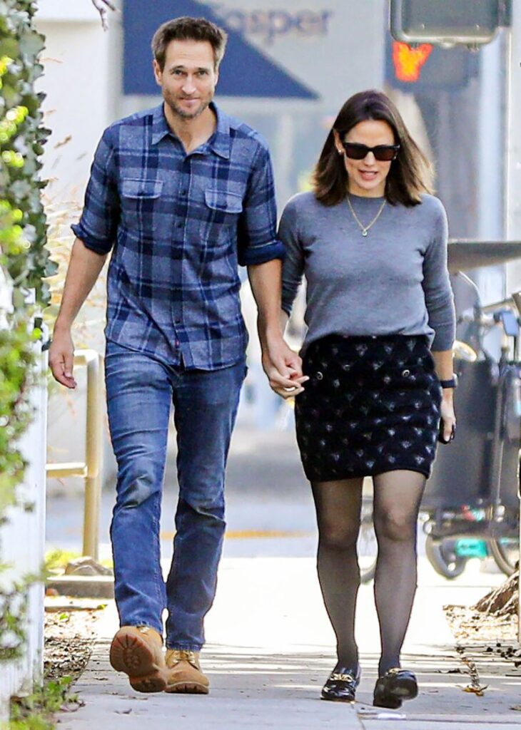 Jennifer Garner and Jennifer Lawrence holding hands on a date night