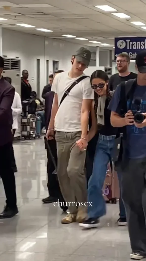 Olivia Rodrigo and Louis Partridge arriving in Manila