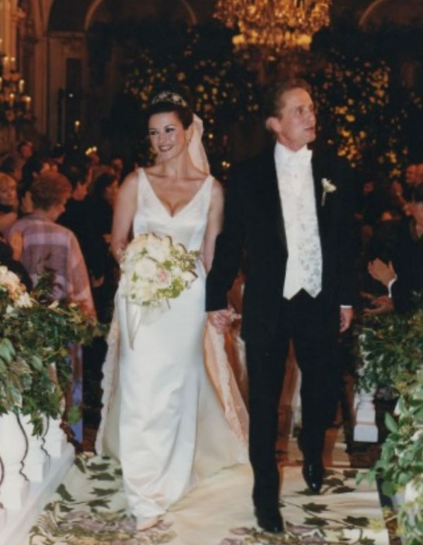 Catherine Zeta-Jones and Michael Douglas walking down the aisle after their wedding ceremony