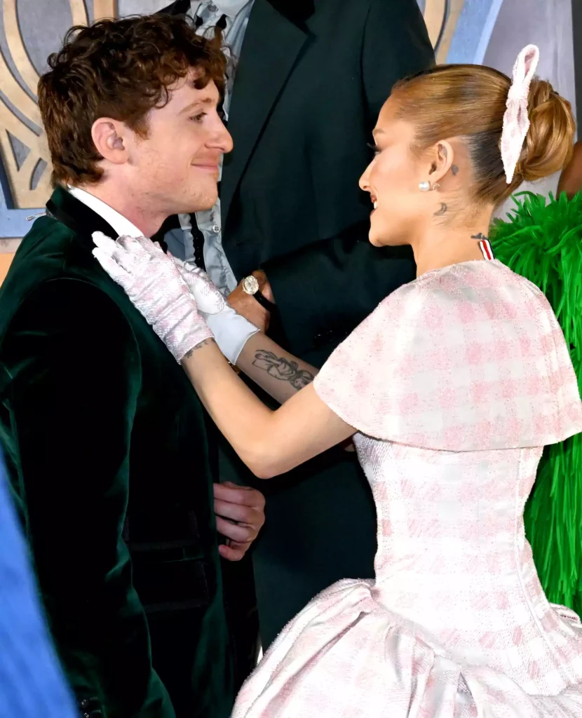 Ethan Slater and Ariana Grande on the red carpet of the premiere of their film Wicked