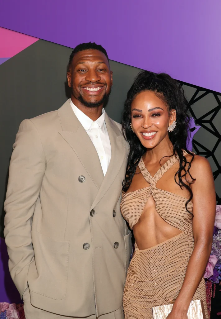 Jonathan Majors and Meagan Good on the red carpet of an event