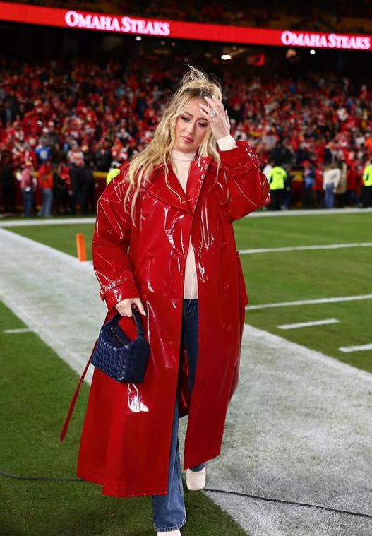 Brittany Mahomes in a bold red leather outfit at the Kansas City Chiefs' game night