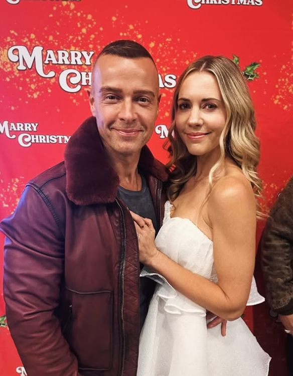 Joey Lawrence and Samantha Cope posing together on the red carpet of their latest film, Marry Christmas