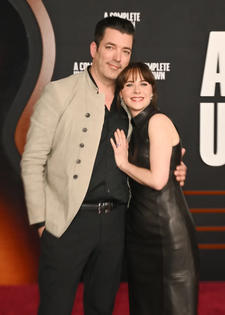 Jonathan Scott and Zooey Deschanel at the premiere of the film, 'A Complete Unknown'