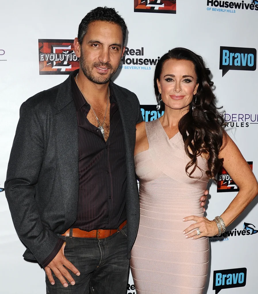 Kyle Richards and Mauricio Umansky posing together on the red carpet of the premiere of The Real Housewives Of Beverly Hills