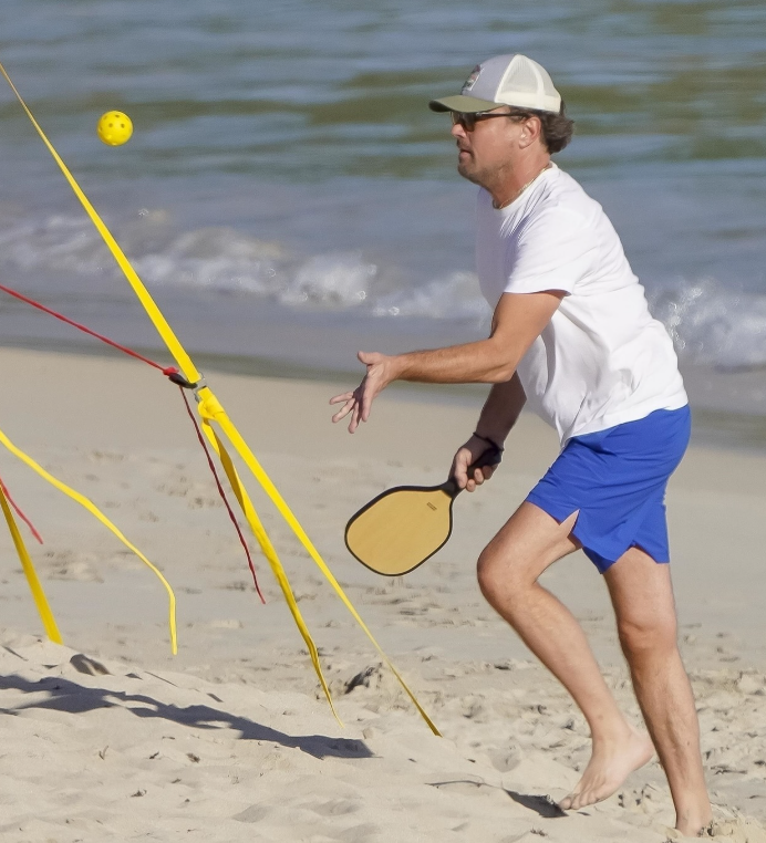 Leonardo DiCaprio engaged in some beach tennis with friends