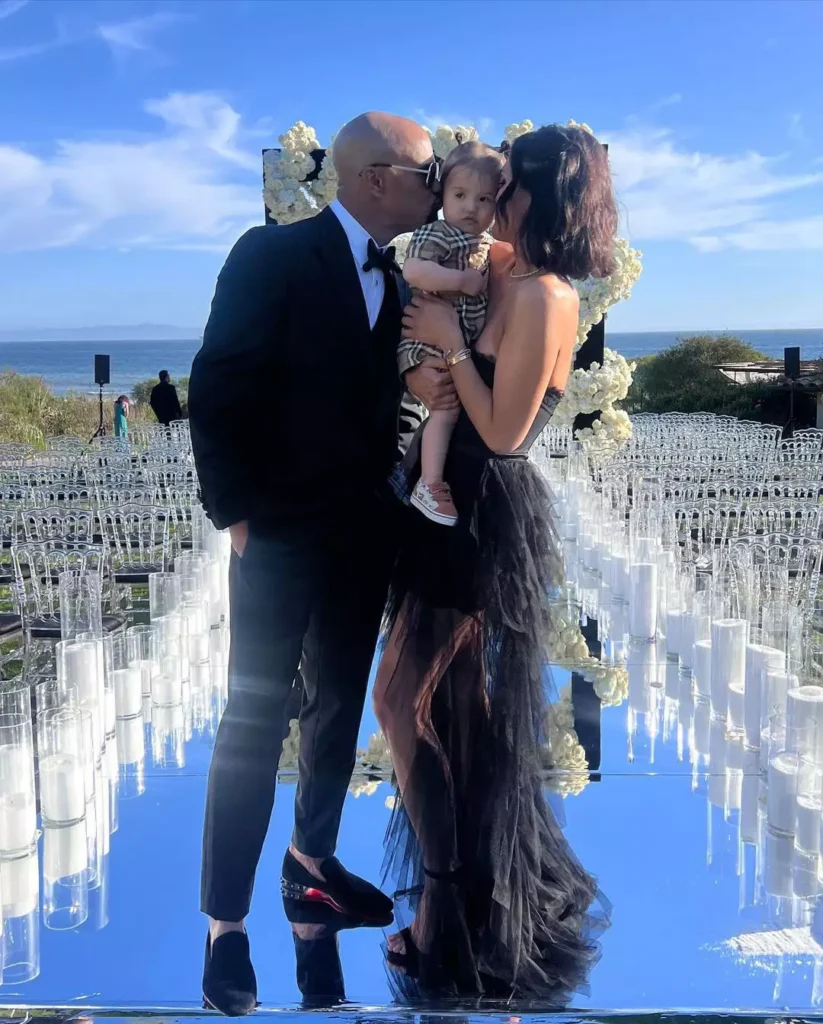 Shemar Moore and Jesiree Dizon with their daughter at a mutual friend's wedding