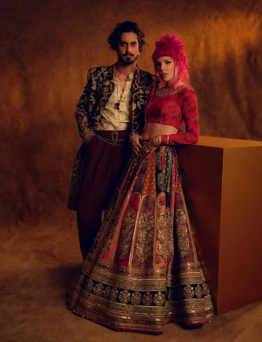 Avan Jogia and Halsey posing together in exquisite Sabyasachi outfits for an event