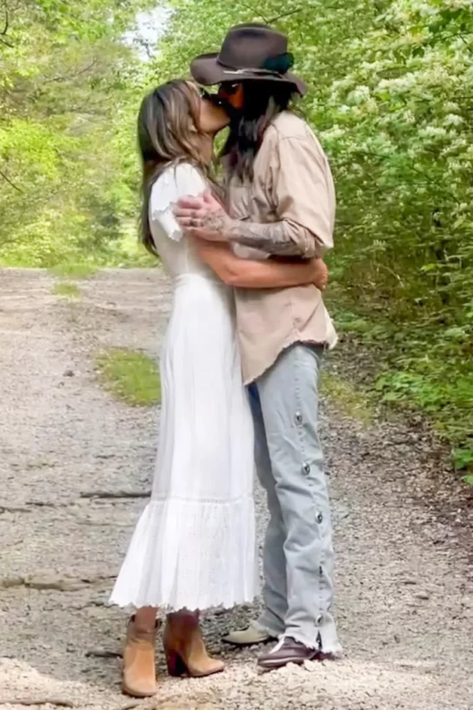 Elizabeth Hurley and Billy Ray Cyrus share a passionate kiss